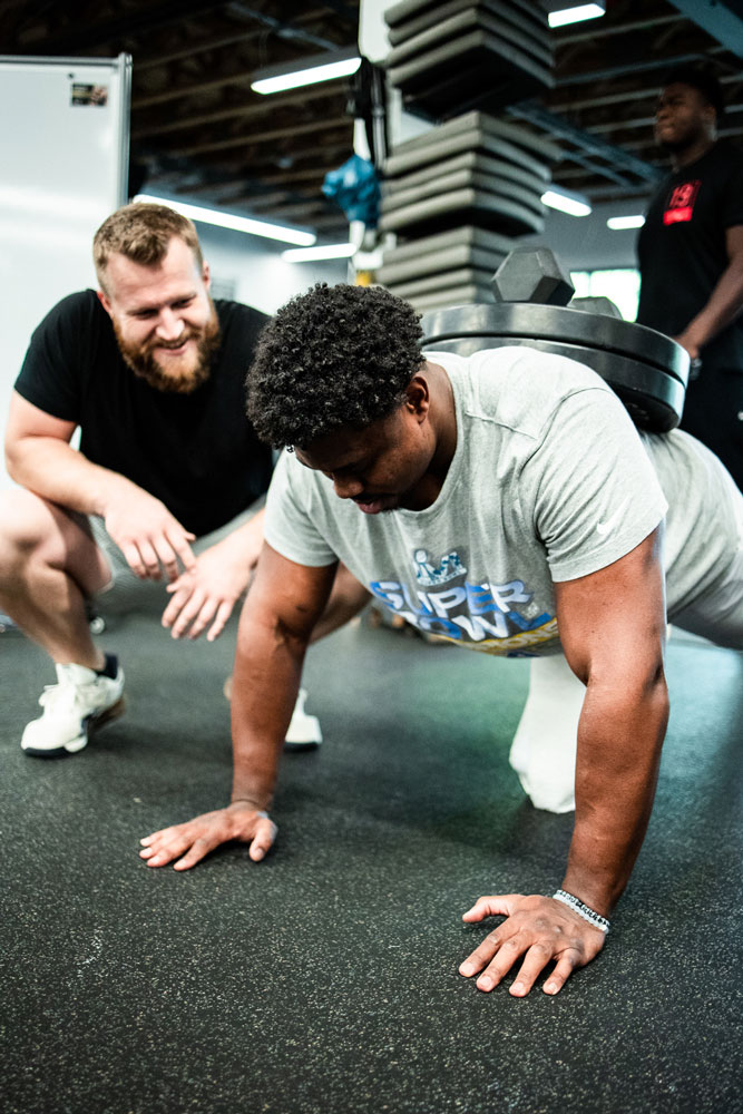 Coach Taylor shaking hand with his client